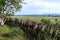 Scenic view on old wooden fence and vineyards of the Alazani Valley