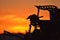 Scenic view of an orange sunset with silhouette of metal structure in the foreground in Australia