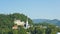 Scenic view over Lake Bled, Julian Alps mountains and church, sunny day, Bled, Slovenia