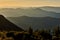 Scenic view over layers of mountains in the sunset