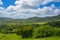 Scenic view over peaceful green prairies and fields