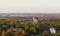 Scenic view on Pidkamin inselberg on adjacent hill and nearby village in Brody region of Galychyna, Ukraine