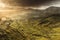 Scenic view of Quiraing mountains in Isle of Skye, Scottish highlands, United Kingdom. Sunrise time with colourful an rayini