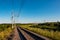 Scenic view of railway tracks turning right in the countryside