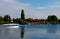 Scenic view of a reflective lake with shoreline trees and buildings, Konstanz, Germany