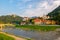 Scenic view on river Savinja, Capuchin monastery, houses in Breg and castle hill in Celje, Slovenia