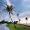 Scenic view of road beside beach