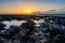 Scenic view of rocky beach at sunset