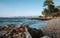 Scenic view of a rocky beach, with the vast blue ocean stretching out in the background.