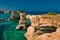 Scenic view of the rocky cliffs of St. Andrew on the coast of Salento, in Apulia Italy.