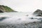 Scenic view of the rocky shoreline along Tunnels Beaches in Ilfracombe, England with a stunning view