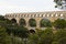 Scenic view of Roman built Pont du Gard aqueduct, Vers-Pont-du-Gard in South of France.