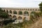 Scenic view of Roman built Pont du Gard aqueduct, Vers-Pont-du-Gard in South of France.