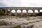 Scenic view of Roman built Pont du Gard aqueduct, Vers-Pont-du-Gard in South of France.