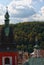 Scenic view of the roofs of ancient town Loket. Bell tower of Church of St. Wenceslas in Loket and City hall tower with the clock