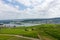 Scenic view of Rudheseim city in Germany from top of the hill , with vineyard, river , and city building.