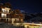 Scenic view of a rustic cabin resort near mountains under a starry night sky in Montgenevre, France