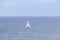 A scenic view of a sailboat along the Scottish coast on May 17, 2022 in Findochty, Moray, Scotland