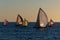 Scenic view of sailboats in the open sea on a sunny afternoon