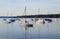 a scenic view of sailing boats in the evening sun in Herrsching on lake Ammersee in Germany