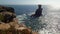 Scenic view of the sea with coastline rocks under the clear blue sky in Peniche, Portugal