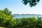 Scenic view of the shore of the bay of the Gelendzhik resort town from the promenade through the greenery of trees and