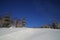 Scenic view of ski slope with a ski trace on non groomed piste.