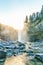 Scenic view of Snoqualmie falls with golden fog when sunrise in the morning.