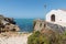 Scenic view of St. Stephen's Chapel against the sea in Baleal, Peniche, Portugal