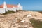Scenic view of St. Stephen's Chapel against the sea in Baleal, Peniche, Portugal