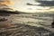 Scenic view of strong waves hitting a rocky coast during high tide