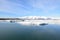 Scenic View of a Stunning Glacial Lagoon with Snow Capped Peaks