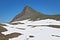 Scenic view of swiss alpine mountain faulhorn and snow fields with small distant hiker