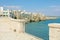 Scenic view from terrace of Mediterranean sea and cliffs of Polignano a Mare town, Apulia, Italy