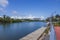 Scenic view of tranquil waterscape against blue sky with white clouds on horizon. Bright sunlit day in Miami Beach,.