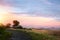 Scenic view of the Tuscany; rolling hills and old road against