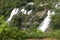 Scenic view of twin waterfalls in mountains