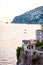 Scenic view on Tyrrhenian sea bay near Fiordo di Furore and Positano mountains region in Campania. Boats floating on water,