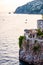 Scenic view on Tyrrhenian sea bay near Fiordo di Furore and Positano mountains region in Campania. Boats floating on water,