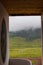 Scenic view of a valley on a cloudy day in Bhutan, landscape with clouds over the mountains.