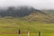 Scenic view of a valley on a cloudy day in Bhutan, landscape with clouds over the mountains.