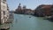 Scenic view of Venetian Grand Canal with old colorful architecture of central districts and St Mark Campanile in sunny