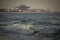 Scenic view of the waves of the Bay of Bengal along Marina Beach with port in background, Chennai, India