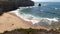 Scenic view of the wavy sea and coastline rocks in Peniche, Portugal