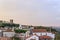 Scenic view of white houses red tiled roofs. and castle of Obidos from wall of fortress. Beautiful old town with medieval