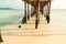 Scenic view of the white sand and clear water seen from under a wooden boardwalk