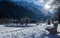 Scenic view on wonderful frozen lake jasna with footbridge in julian alps in blue sky, kranjska gora, Slovenia