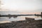 Scenic view of a wooden canoe moored in a river at a cloudy sunset in Madagascar