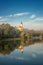 Scenic view of Zupnija Maribor Sv. Jozef church in misty morning landscape with Drava river, Maribor, Slovenia