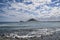 Scenic views on a sunny day with altocumulus clouds, towards Montana Roja from Playa Grande, in El Medano, Tenerife, Canary Island